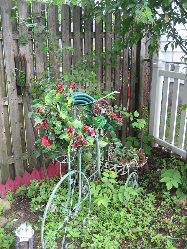 wrought iron scrap pieces made into a garden bicycle and a hose wreath, flowers, gardening, repurposing upcycling, Wrought iron scrap turned into a cute bicycle