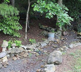 my garden, gardening, outdoor living, Dry creek bed I followed the natural flow of the water when it rained It took me most of the summer using a rotor tiller wheel barrow pic and shovel It was hard work but serves it s purpose