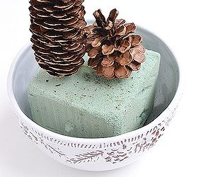 how to make a winter pine cone terrarium, crafts, seasonal holiday decor, terrarium, Stick the dowel into foam you have cut to fit your bowl You may need to cut the dowel so that the pine cones rest right on top