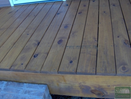 sealing your wood deck for years of enjoyment, decks, home maintenance repairs, how to, Got to love builders that leave those grade stamps facing up we got a few tricks to help eliminate them linked above in this case the homeowner decided to simply leave them