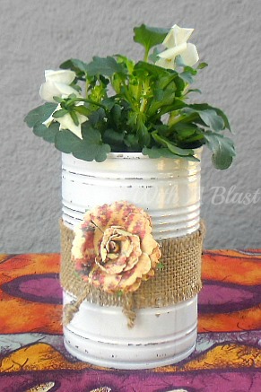 pretty plant pots decoupaged embellished, crafts, decoupage, This can is much simpler but my favorite of the three Painted some sanding over the ridges edge a burlap strip and a lovely faux flower