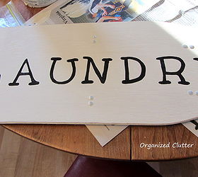 small ironing board laundry sign, crafts, home decor, laundry rooms, repurposing upcycling, I used a Sharpie paint marker to fill in the graphite letters I used both dark and clear wax over my ironing board