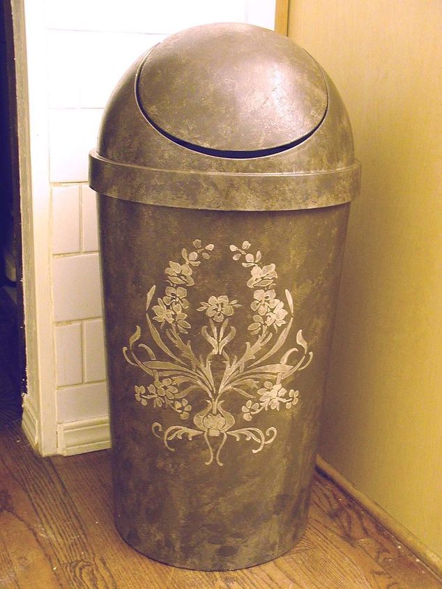 make a plastic garbage can look high end, Stenciling in metallic gold creates a focal design Spray varnish protects the piece