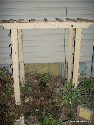 diy cedar trellis, diy, flowers, gardening, woodworking projects, we cut angled bases on the bottom of the posts and carefully drove the arbor down into the flower bed