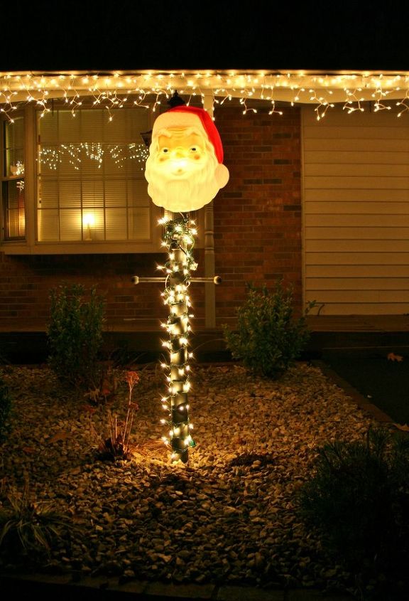 cozy red home christmas tour, seasonal holiday d cor, I love this light up vintage Santa we keep on our light post outside