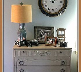 living room makeover reveal, home decor, living room ideas, This dresser was also a goodwill find Made over and the clock and lamp Goodwill finds too And now its a spot for some of my collection of vintage cameras