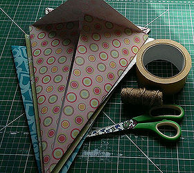 diy giant party decorations, crafts, Add a strip of double sided tape inside the fold stick the sides of your triangle down Place the string in the top fold and stick down holding the string in place