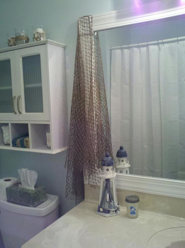 another bathroom update, bathroom ideas, home decor, painting, Easy DIY mirror frame and the net to add an ocean feel