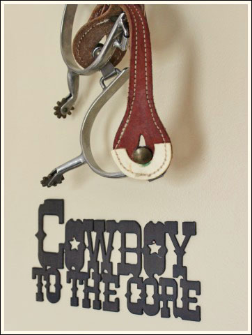 decorating a boy s bedroom, bedroom ideas, home decor, Old spurs and a fun sign