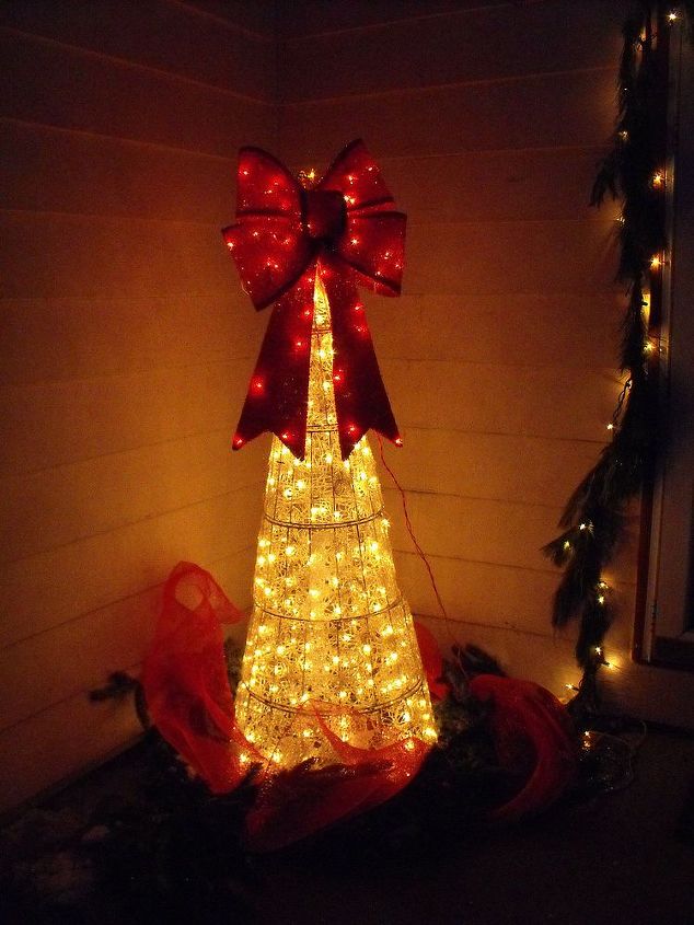 outdoor christmas decorations, seasonal holiday d cor, Outside Christmas Tree that would never stay up finally found a place for it by my front door I added the lighted bow to the top