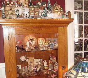 i love decorating our 1895 queen anne victorian for christmas with 12 trees, christmas decorations, seasonal holiday decor, wreaths, Cabinet with Dickens village one of many