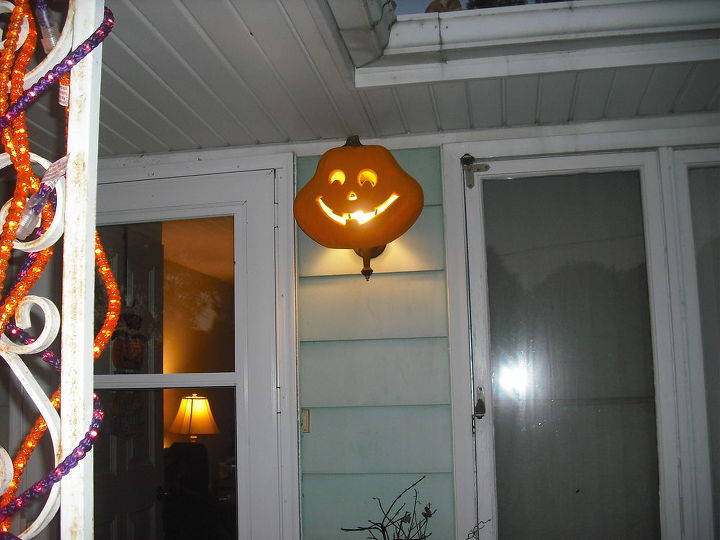my halloween decorating so far, curb appeal, flowers, halloween decorations, seasonal holiday decor, Took pumpkin and cut bottom out of it got a funny looking one before stalks are up