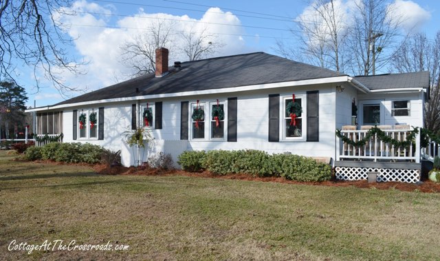 a country cottage decorated for christmas, curb appeal, seasonal holiday decor, country cottage