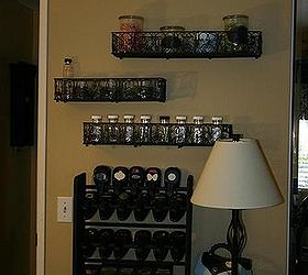 my craft room, craft rooms, home decor, Wooden shoe rake was painted black and holds my punches Wire Baskets above were also painted black and old Watson spice bottles hold my embellishments