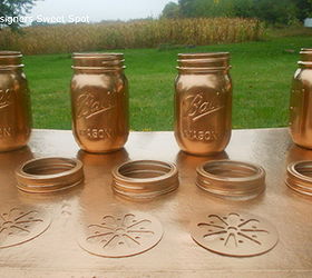 mason jar candles, crafts, mason jars, repurposing upcycling, seasonal holiday decor, I started with basic pint sized jars bands and candle style lids from the craft store I painted them copper with Krylon spray paint