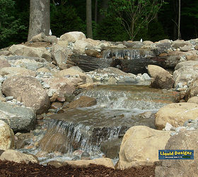 large pondless waterfall with strong water rushing through a split stream and over, curb appeal, outdoor living, ponds water features, Completed project prior to any landscaping