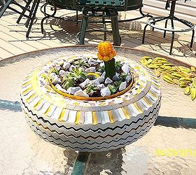 the leopart tire planter, gardening, repurposing upcycling, Perfect fit right in the middle of our never used glass table on the deck what a centerpiece