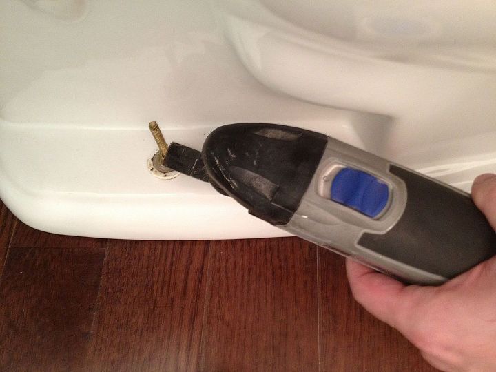 fix a moving of leaking toilet bowl before the holidays, home maintenance repairs, how to, Trim the closet flange bolts with a Dremel or hacksaw I love the Dremel for this