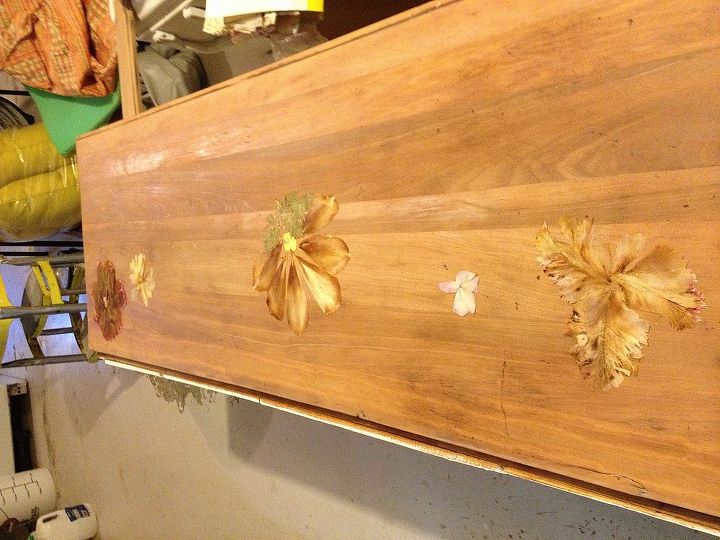 decoupaging pressed flowers on furniture, the total surface of the buffet Pressed flowers are ready to be glued