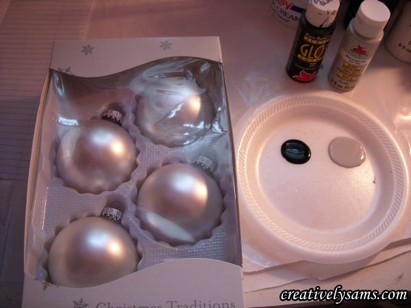 snow leopard ornaments tutorial, christmas decorations, crafts, seasonal holiday decor, The supplies All you need is a package of ornaments I got mine at the Dollar Tree some acrylic light grey paint some acrylic black paint 2 sizes of flat paint brushes and a detail brush