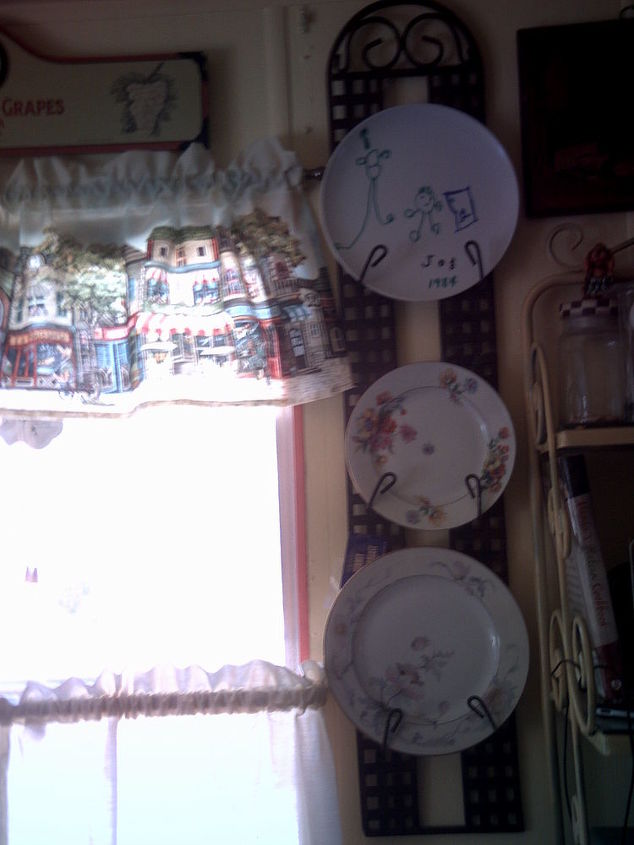 my old country memory kitchen, home decor, kitchen design, wreaths, top a dish my son made and Grandma s dishes on the wall There are more on the other side of the window