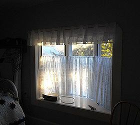 small room makeover on a small budget, bedroom ideas, home decor, This window is so much nicer white but was a real challenge to curtain Those curtains are made from vinyl tablecloth fabric with an eyelet in the design
