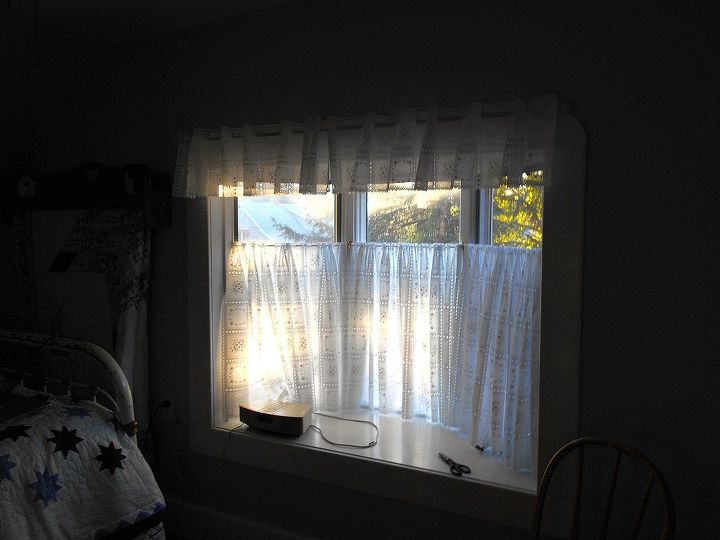 small room makeover on a small budget, bedroom ideas, home decor, This window is so much nicer white but was a real challenge to curtain Those curtains are made from vinyl tablecloth fabric with an eyelet in the design