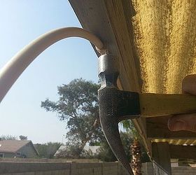 installing a cool misting system to beat the summer heat, outdoor living, I attached it with the included nail in clips They were similar to the little white clips you normally see cable tv wiring only in a delightful tube matching tan