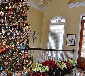 christmas tree and mantel, christmas decorations, seasonal holiday decor, Tree with poinsettias lining the stairwell