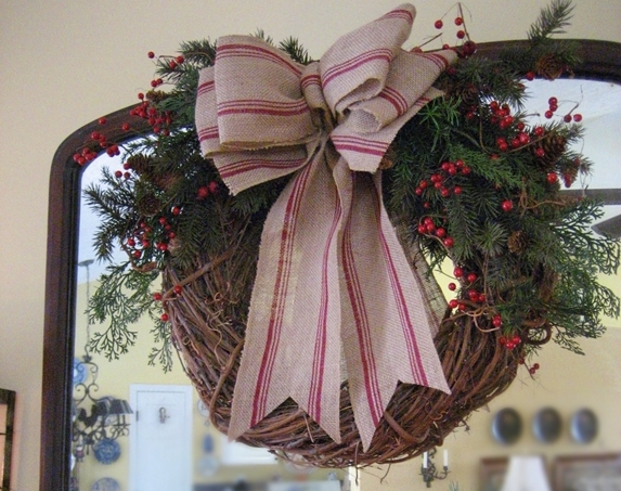 my farmhouse christmas mantel, christmas decorations, seasonal holiday decor, wreaths, A grapevine wreath with a grain sack ribbon and greenery finishes off the mantel