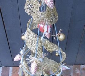 re purposing a tomato cage into a christmas tree, christmas decorations, repurposing upcycling, seasonal holiday decor, Tree decorated This one stands 54 tall but smaller cages are available