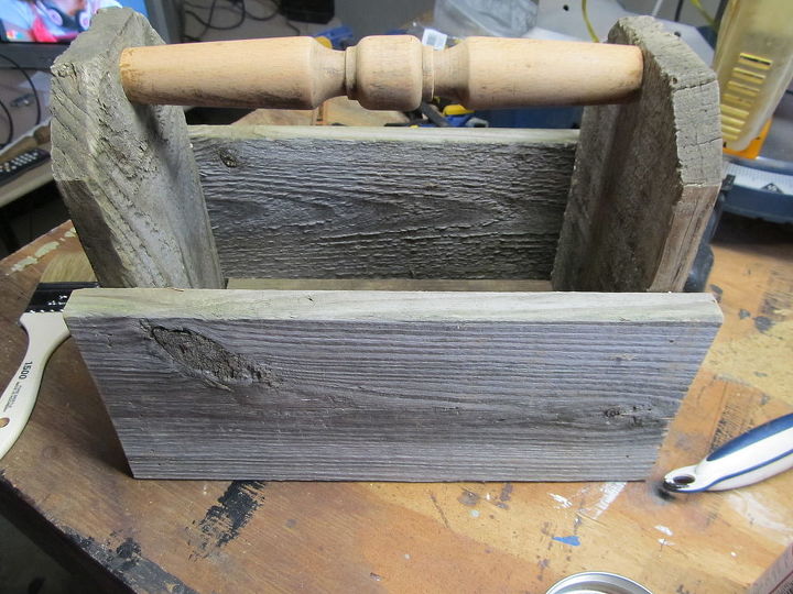 rustic caddy using reclaimed fence, repurposing upcycling, woodworking projects, I drilled a pilot hole on each side and used a black drywall screw to secure the handle