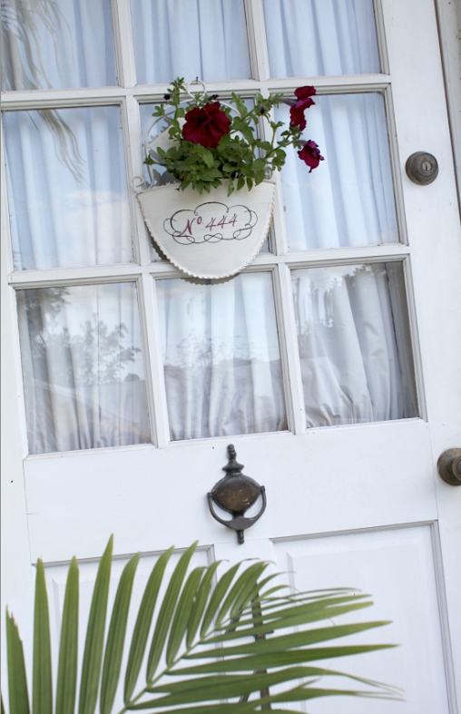 brighten your front door with blooms in a hanging pocket planter, container gardening, doors, gardening