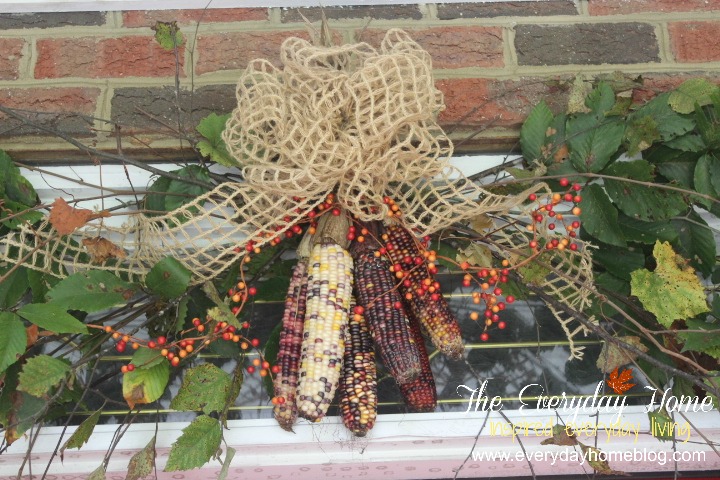 a southern fall front porch, doors, porches, seasonal holiday decor, wreaths, Indian Corn is hung above the door
