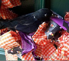 make a halloween fabric wreath, crafts, halloween decorations, repurposing upcycling, seasonal holiday decor, wreaths, Hot glue some fun Halloween add ons Here are black crows