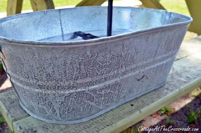 topsy turvy galvanized bucket planter, crafts, gardening, New galvanized buckets can be aged by spraying them with bleach