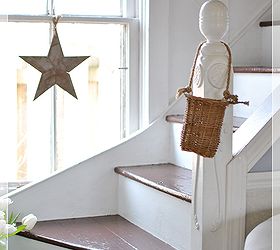 the secret to dealing with quirky room challenges, home decor, A simple wooden star adds interest to the window oddly placed at the bottom of the stairway