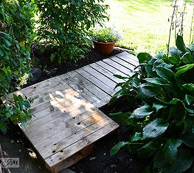 cheating with an instant full pallet garden walkway, concrete masonry, diy, landscape, pallet, repurposing upcycling, The pallets were then tucked into place