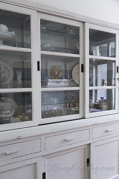 hutch makeover with milk paint, painted furniture, The smooth finish on the shelves and doors of the hutch made it necessary to use some bonding agent