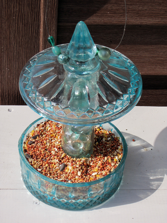 diy candy jar birdfeeder, crafts, repurposing upcycling, A view from the top of the bird feeder ready to hang