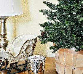 from christmas to winter in a few simple steps, fireplaces mantels, seasonal holiday d cor, I kept the sleigh on the table took the top off the Christmas tree and placed it in a basket A mercury candle adds a bit of sparkle to finish it off
