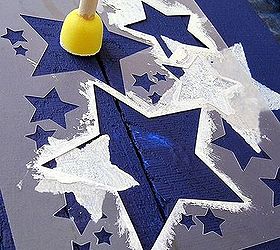 how to make an american flag from a pallet, crafts, pallet, patriotic decor ideas, repurposing upcycling, seasonal holiday decor, My kids painted each of the stars I randomly placed the star stencil in the blue section Random placement made it easy