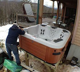 bullfrog spa installed on a second story deck in windham new york, Cover lifter being installed on this Bullfrog Spa in Windham New York