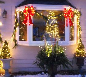 outdoor christmas decorations, seasonal holiday d cor, Theme of candy cane colors red and white Colors really popped from the street Winter container in the middle with twig lights