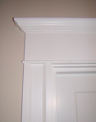 my 5 year olds bedroom remoldel, bedroom ideas, painted furniture, woodworking projects, Added trim and crown moulding to the outside of her door located in the upstairs hallway