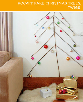 four rockin fake christmas trees, christmas decorations, seasonal holiday decor, Twigs Perfectly straight sticks are hard to come by but if you manage to find a bunch turn them into a makeshift tree Place your branches on the wall and roll them until they re relatively flush against the surface