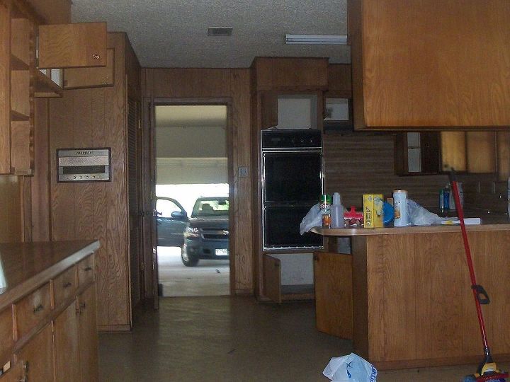 q bought this 1960 s ranch in really bad shape kitchen remodel pics, home improvement, kitchen backsplash, kitchen design, Tore out cabinets wood paneling 4 layers of linoleum and appliances