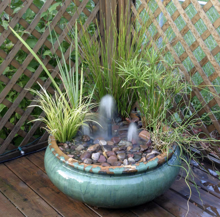 container water gardens, container gardening, gardening, ponds water features, Small fountains in a small deck container provide whimsy and the melodic sound of water