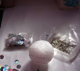 paillette ornaments, crafts, I started with a Styrofoam ball I added straight pins to the north south of the ball just to keep me on track Then using a Sharpie I drew lines around the ball This too was to keep my rows on track