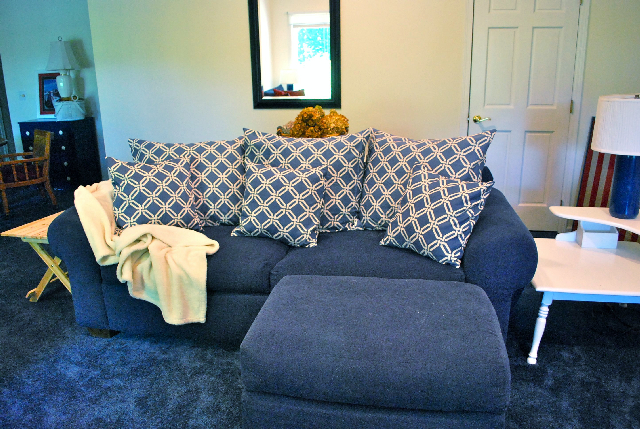 you can update your furniture without upholstery, painted furniture, Giant Pillow Shams brighten up the dark blue couch